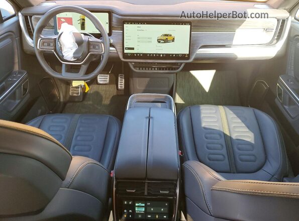 7FCTGAAA2PN019677 2023 RIVIAN RIT Yellow Սարքավորումների վահանակի տեսք