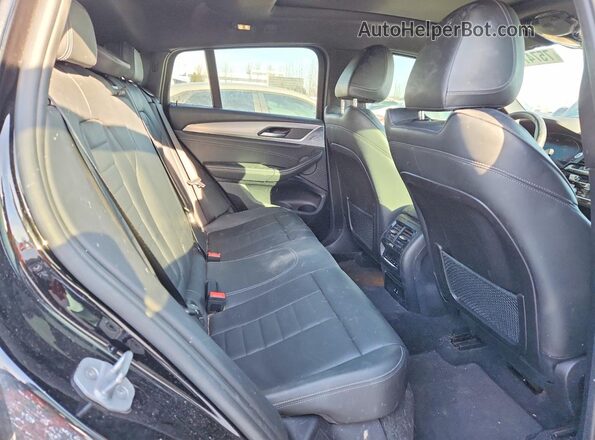 5UX2V1C08M9D99948 2021 BMW X4 Black Widok wnętrza z tyłu