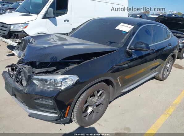 5UX2V1C08M9F13754 2021 BMW X4 Black Առջևի ձախ երեք քառորդ տեսարան