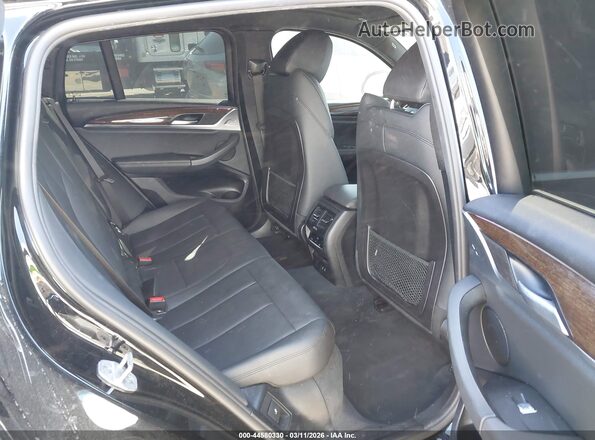 5UX2V1C08M9F13754 2021 BMW X4 Black VIN կոդի պիտակի տեսք