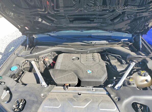 5UX33DT01P9P09757 2023 BMW X4 Black Vista del compartimento del motor