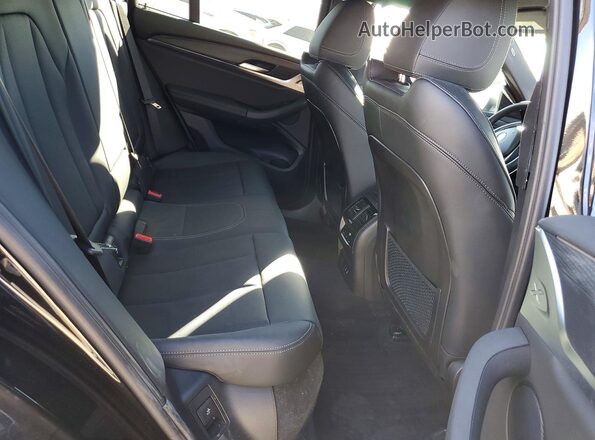 5UX33DT01P9P09757 2023 BMW X4 Black Vista interior trasera