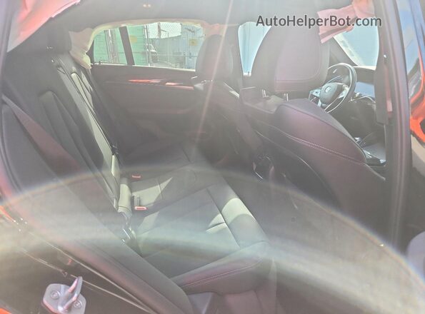 5UX33DT01P9T04692 2023 BMW X4 Black Vista interior trasera