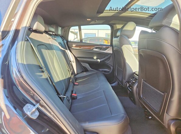 5UX33DT02P9S75252 2023 BMW X4 Charcoal Rear interior view