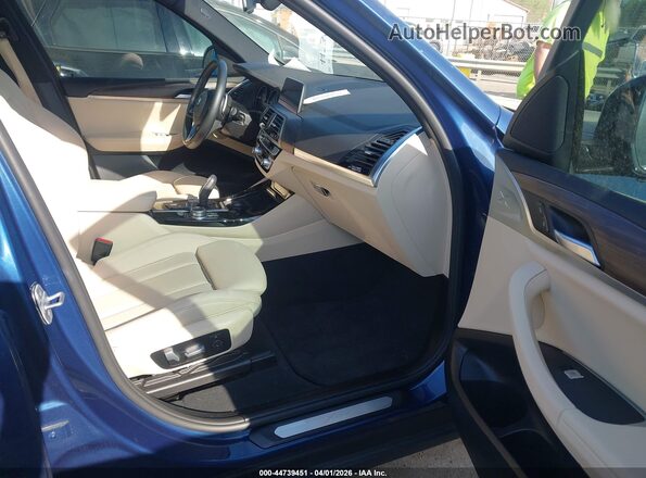 5UXTY3C0XM9F93615 2021 BMW X3 Blue Vista interior delantera