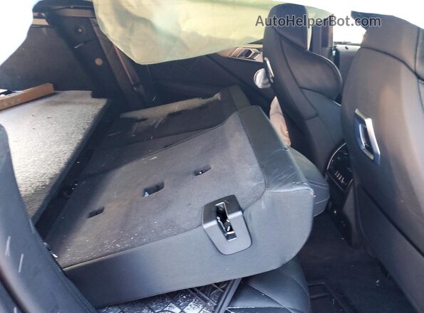 5YM23CS03S9Z60059 2025 BMW XM Black Вид задньої частини салону