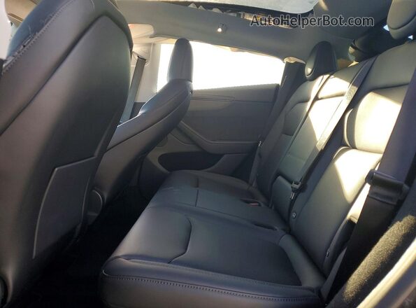 7SAYGDED1TF537387 2026 TESLA MODEL Black Rear seats view