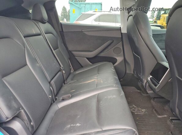 7SAYGDEE0TF339862 2026 TESLA MODEL Gray Vista de los asientos traseros