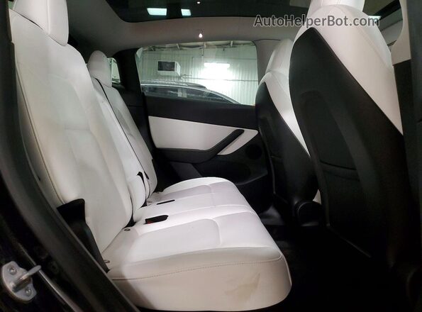 7SAYGDEF0NF382724 2022 TESLA MODEL Black Rear interior view
