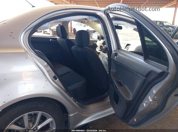 JA32U2FUXGU011530 2016 MITSUBISHI LANCER Silver Widok naklejki z numerem VIN