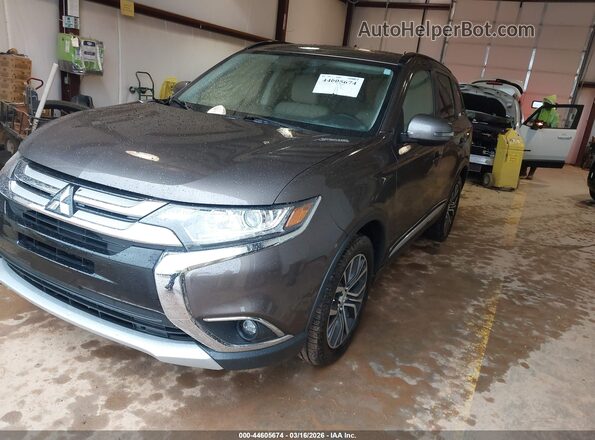 JA4AZ3A3XGZ024259 2016 MITSUBISHI OUTLANDER Gray Vista tres cuartos delantera izquierda
