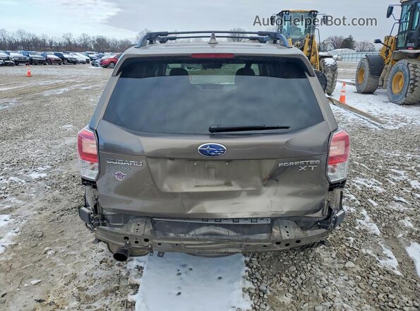 JF2SJGWC9HH545306 2017 SUBARU FORESTER2. Tan Rear view