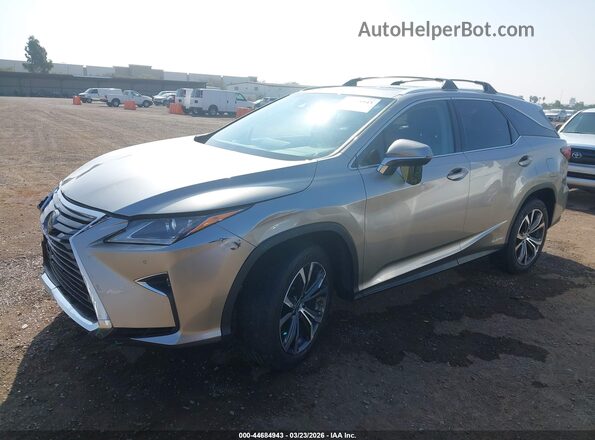 JTJDGKCA1J2002193 2018 LEXUS RX 450HL Silver Vista tres cuartos delantera izquierda