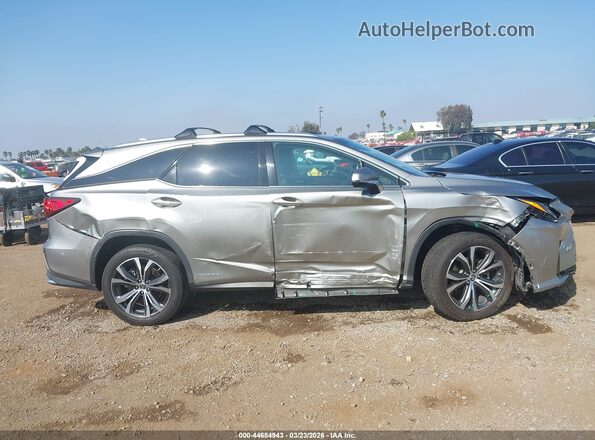 JTJDGKCA1J2002193 2018 LEXUS RX 450HL Silver Vista interior trasera