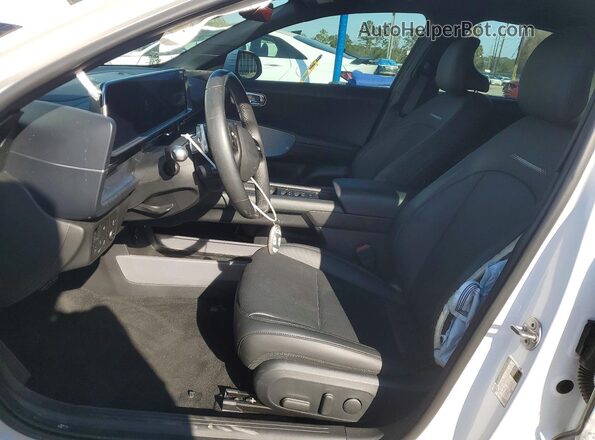 KMHM34AA2PA049255 2023 HYUNDAI IONIQ White Front interior view