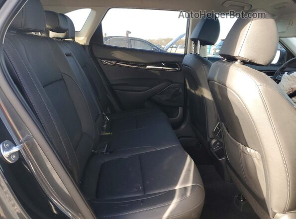 KNDER2AA7S7687907 2025 KIA SELTOS Charcoal Vista interior trasera