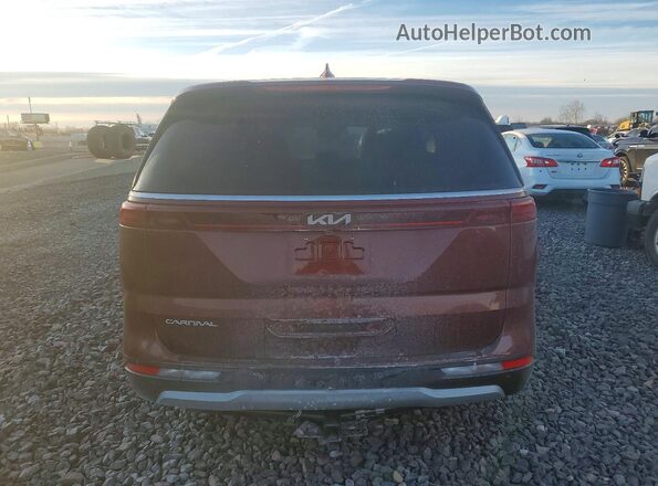 KNDNB4H32P6229034 2023 KIA CARNIVAL Темно-бордовый Вид сзади