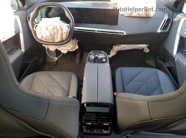 WB523CF00RCS04507 2024 BMW IX Maroon Dashboard view