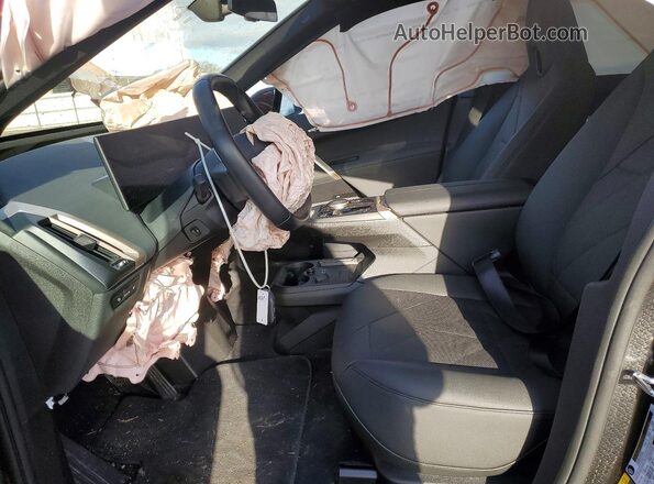 WB523CF00RCS04507 2024 BMW IX Maroon Front interior view