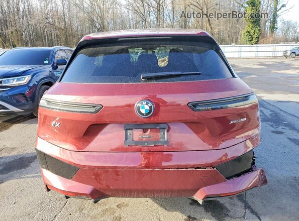 WB523CF00RCS04507 2024 BMW IX Maroon Rear view