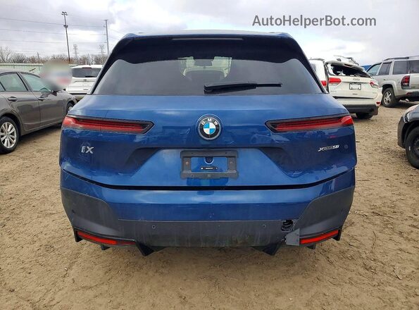 WB523CF03RCR10807 2024 BMW IX Blue Вид ззаду