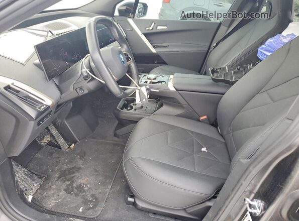 WB523CF08RCR16702 2024 BMW IX Black Front interior view