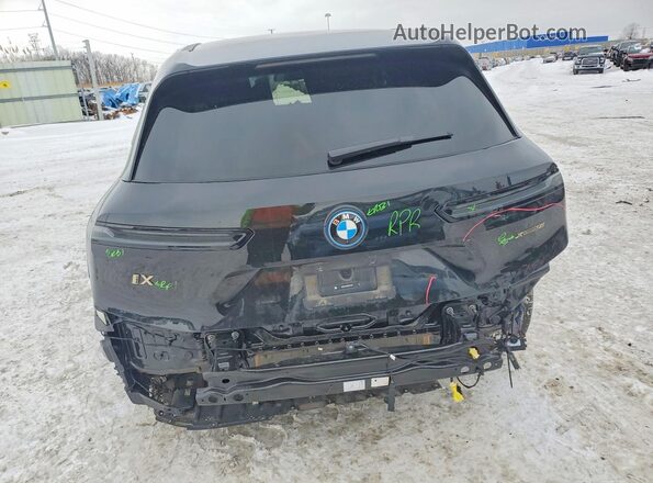 WB523CF08RCR16702 2024 BMW IX Black Rear view