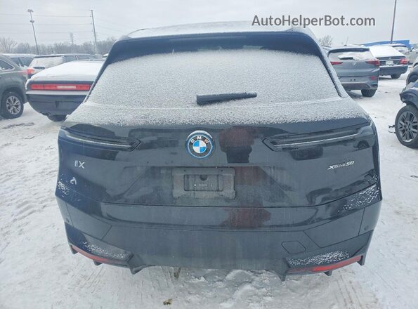 WB523CF08RCR20829 2024 BMW IX Black Vista trasera