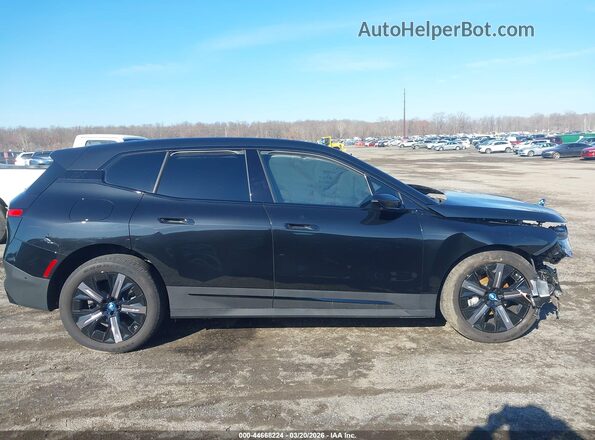 WB523CF08SCU44619 2025 BMW IX Черный Вид задней части салона