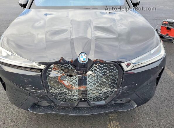 WB533CF04SCT56283 2025 BMW IX Charcoal Սալոնի հետևի տեսք