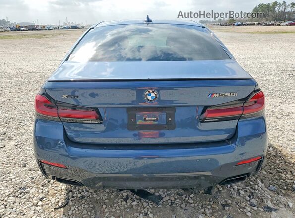 WBA13BK09PCM32189 2023 BMW M5 Blue Rear view