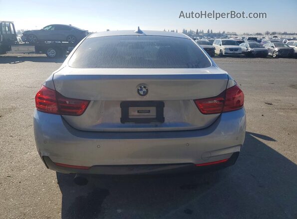 WBA4A9C54GGL89671 2016 BMW 4 SERIES Silver Rear view