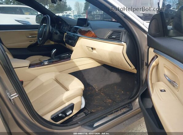 WBA4F7C58HG437616 2017 BMW 4 SERIES Желто-коричневый Вид салона спереди