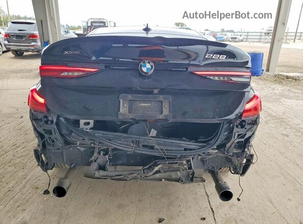 WBA73AK01L7F91203 2020 BMW 2 SERIES Black Rear view