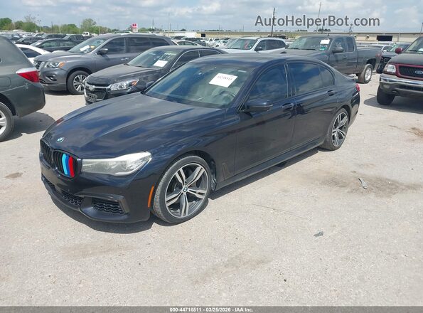 WBA7E2C50GG504596 2016 BMW 7 SERIES Dark Blue Առջևի ձախ երեք քառորդ տեսարան