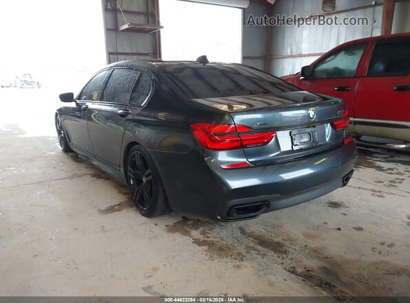 WBA7F2C57GG415668 2016 BMW 7 SERIES Gray Trasero izquierdo