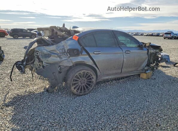 WBAJB9C54JB036559 2018 BMW M5 Gray Trasero derecho