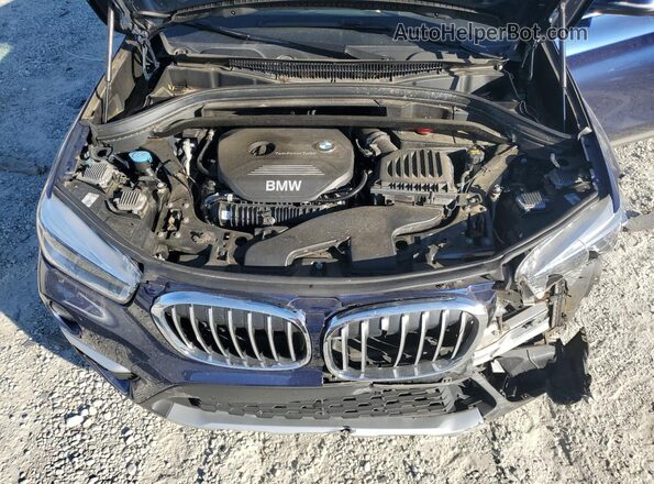 WBXHT3C36H5F75127 2017 BMW X1 Blue Vista del compartimento del motor