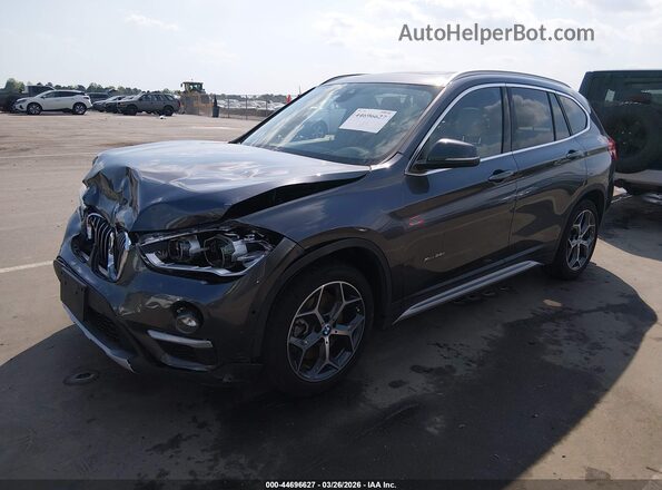 WBXHT3Z36H4A65695 2017 BMW X1 Gray Vista tres cuartos delantera izquierda
