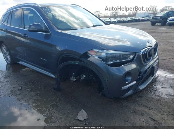 WBXHT3Z39H4A54335 2017 BMW X1 Gray Widok z przodu