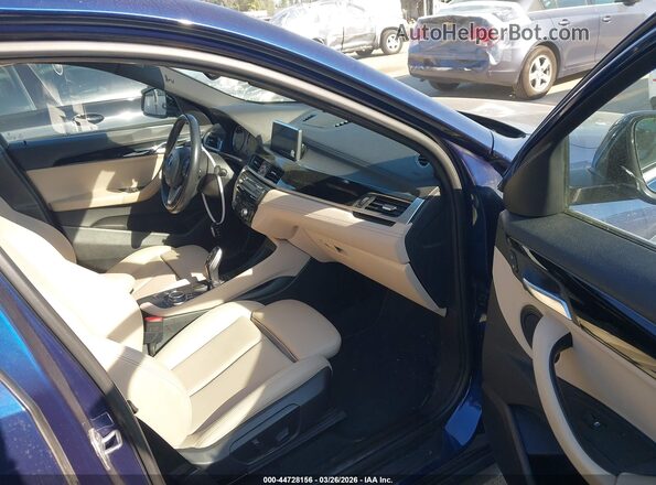 WBXYH9C04L5P00416 2020 BMW X2 Blue Vista interior delantera