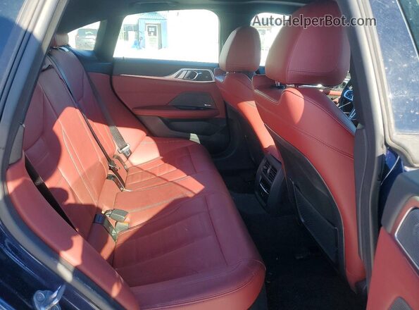 WBY33AW05NFM60680 2022 BMW I4 Blue Vista de los asientos traseros