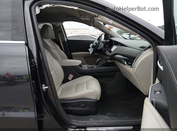 1GYFZDR4XPF199864 2023 CADILLAC XT4 Black Front interior view