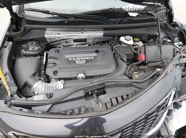 1GYFZDR4XPF199864 2023 CADILLAC XT4 Black Rear view