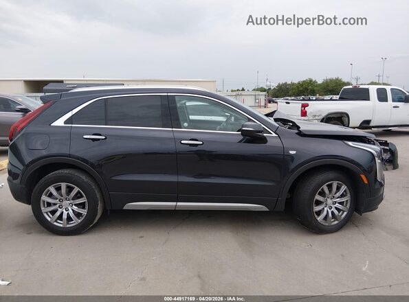 1GYFZDR4XPF199864 2023 CADILLAC XT4 Black Rear interior view