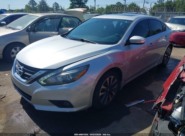 1N4AL3AP7GC176549 2016 NISSAN ALTIMA Silver Vista tres cuartos delantera izquierda