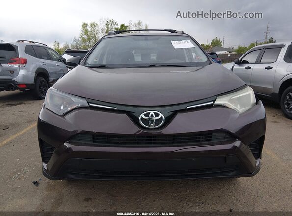 2T3BFREV4GW531675 2016 TOYOTA LE Burgundy Rear interior view