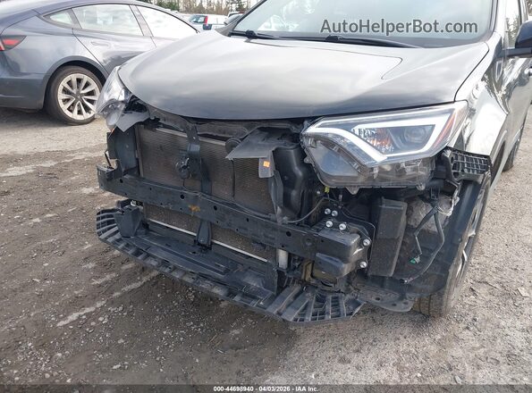 2T3JFREVXGW495552 2016 TOYOTA RAV4 Black Front view