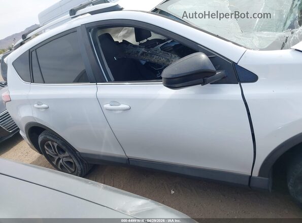 2T3ZFREV2GW261912 2016 TOYOTA LE White Rear interior view