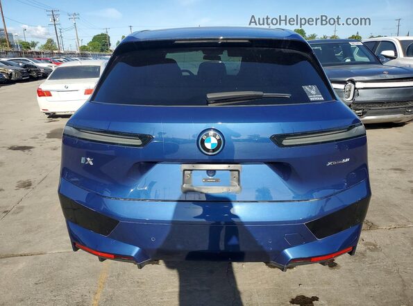 WB523CF06RCP23335 2024 BMW IX Blue Vista interior delantera